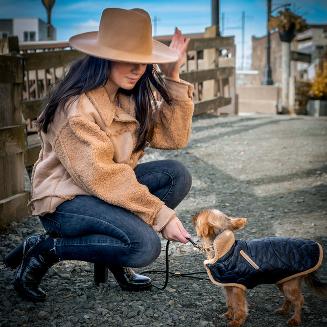 Malissa adjusting Chloe's Chocolate and Camel Collar in a Black Parka